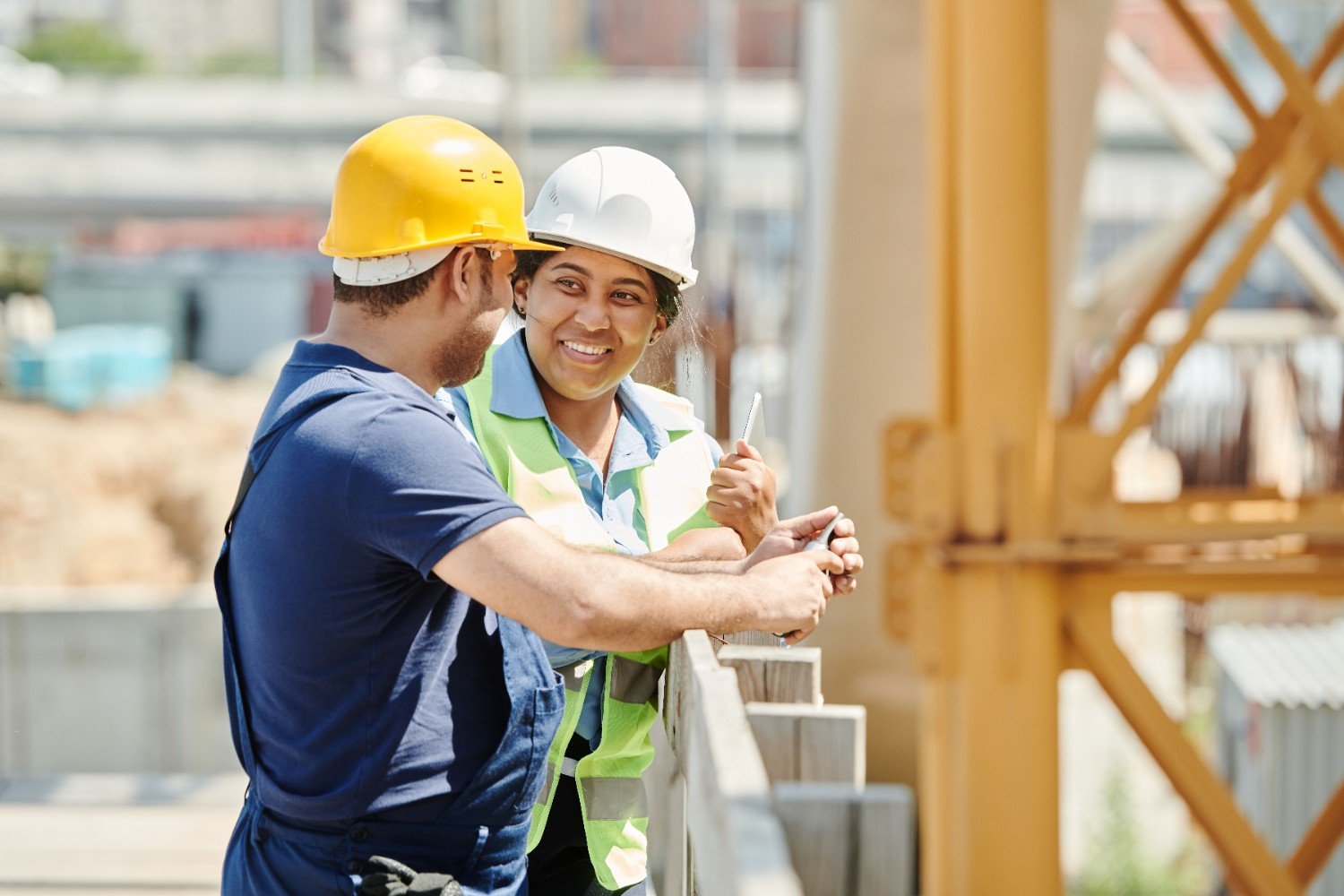 BUILDCORE construction team reviewing blueprints on site